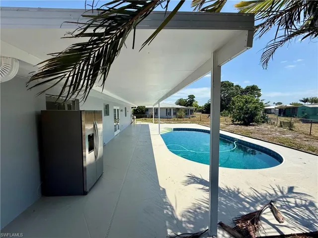 Outdoor pool featuring a patio area