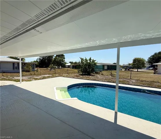 Outdoor pool with a patio