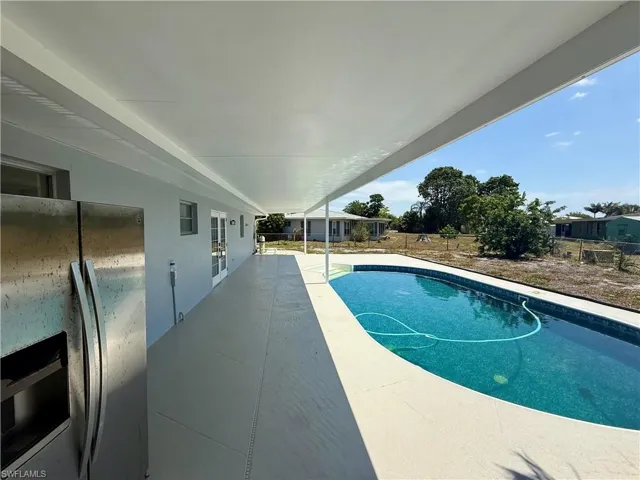 View of pool with fence, a patio area, and a fenced in pool