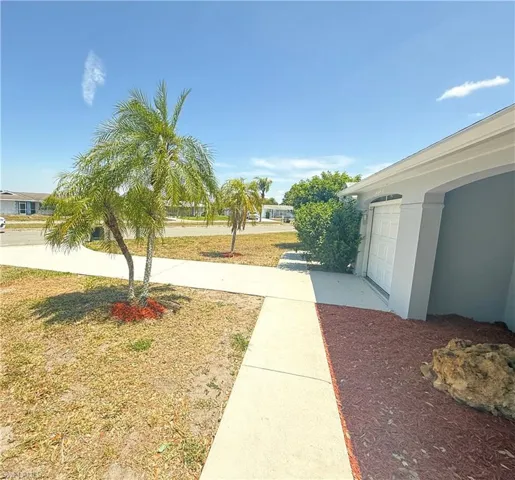 View of yard with a garage