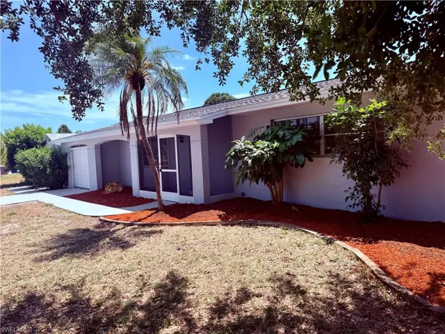 Ranch-style home with an attached garage and stucco siding