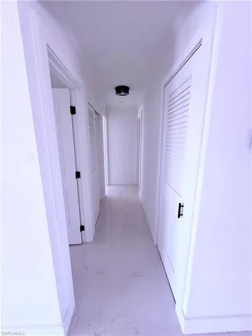 Corridor with marble finish floor