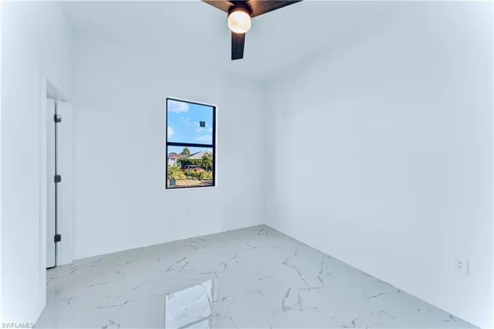 Spare room featuring ceiling fan