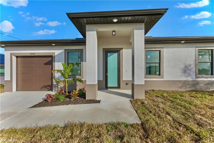 Entrance to property featuring a garage