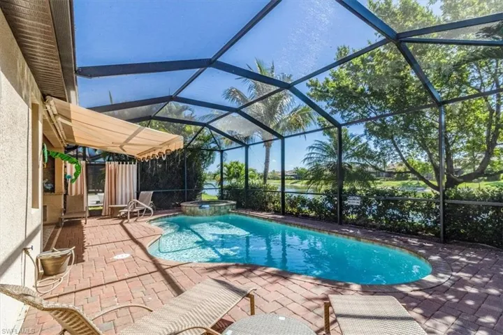 Pool with extendable lanai shade open