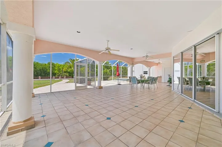 View of patio / terrace featuring outdoor dining area and ceiling fan