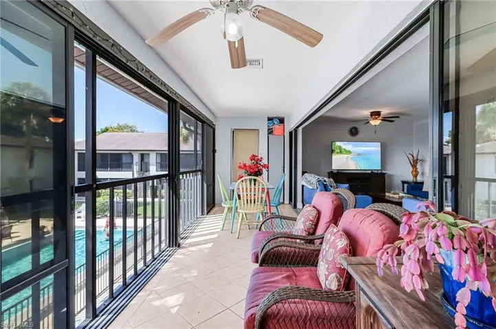 Sunroom featuring ceiling fan