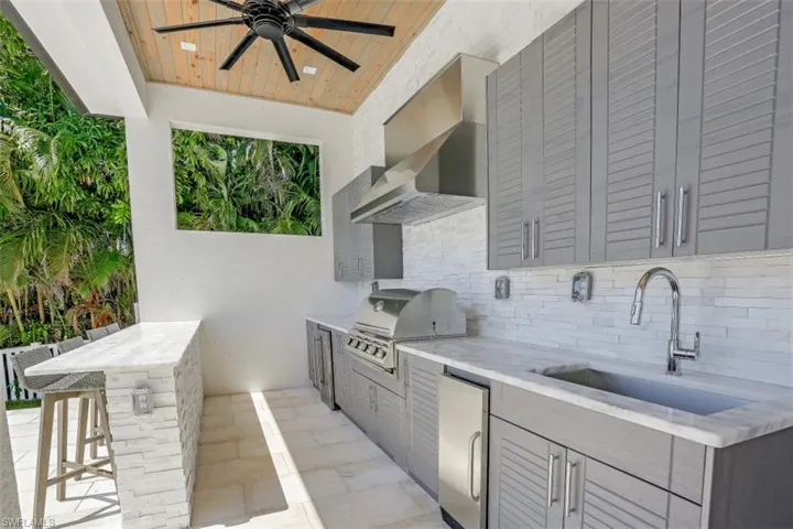 View of patio with ceiling fan