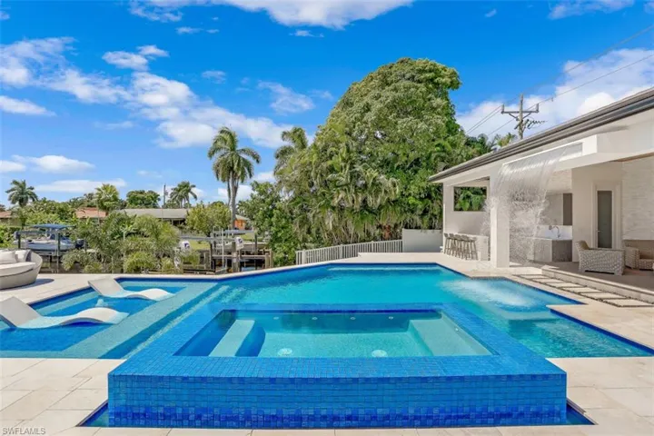 Swimming pool with a patio