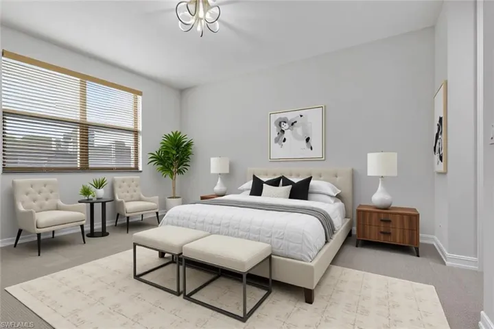 Carpeted bedroom with baseboards