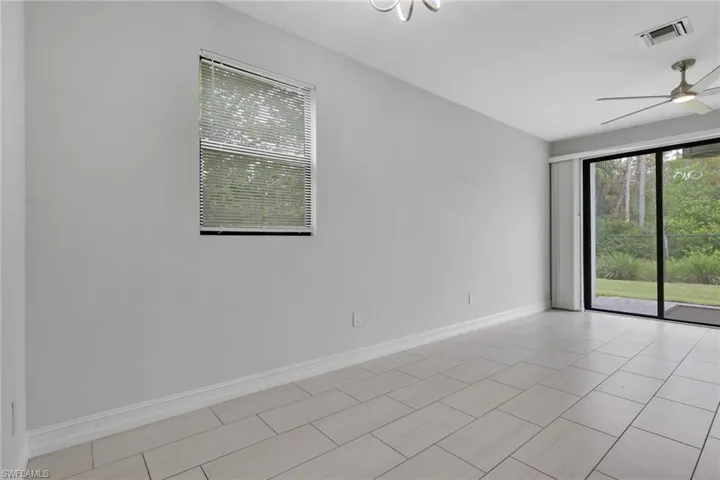 Unfurnished room with plenty of natural light and ceiling fan
