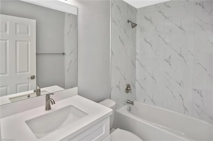Bathroom featuring vanity and bathtub / shower combination