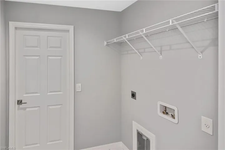 Laundry area featuring electric dryer hookup and hookup for a washing machine