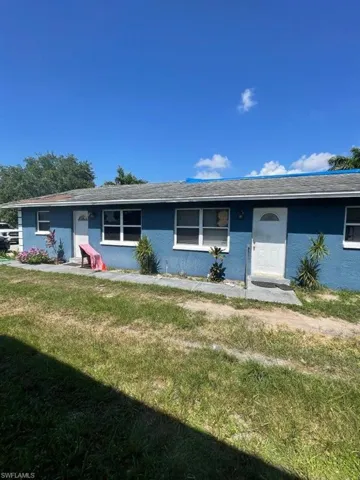 Ranch-style house with a front lawn
