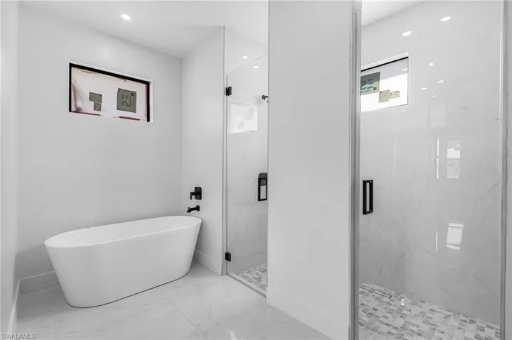 Bathroom with independent shower and bath