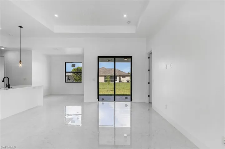 Spare room with a raised ceiling