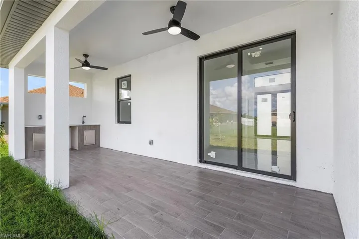 View of patio / terrace featuring an outdoor kitchen and ceiling fan