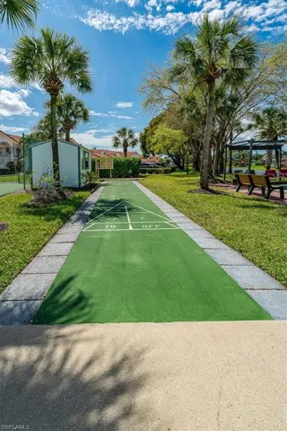 View of property's community with shuffleboard