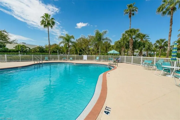 Community pool with a patio area