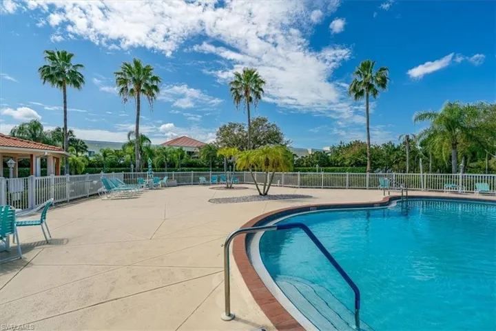 Community pool with a patio