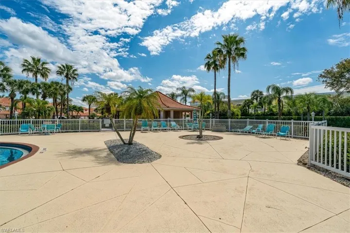 Community pool with a patio