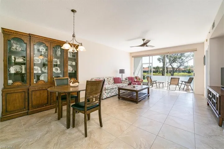 Dining space featuring hanging lights and ceiling fan