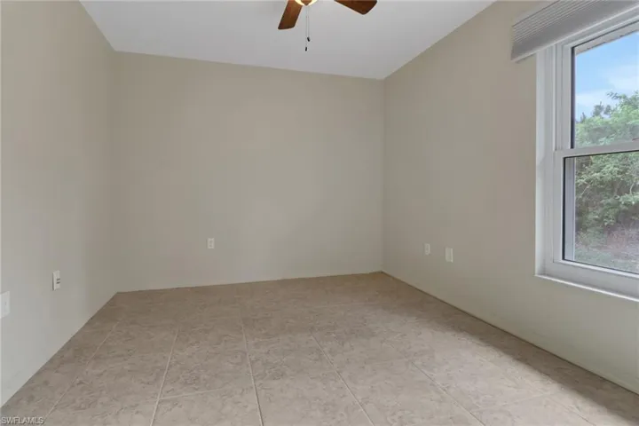 Empty room featuring ceiling fan