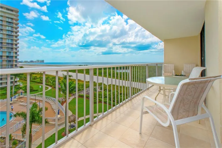 Balcony with a beach view and a water view