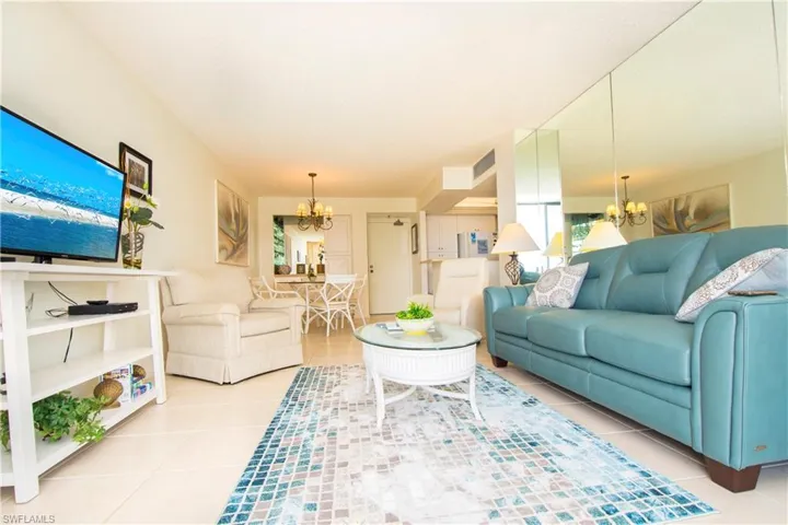Living room featuring a chandelier and light tile patterned floors