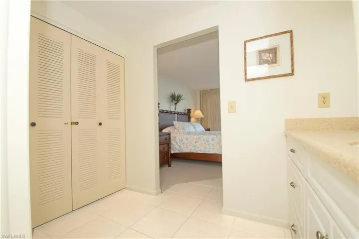Bedroom featuring a closet and light tile patterned floors