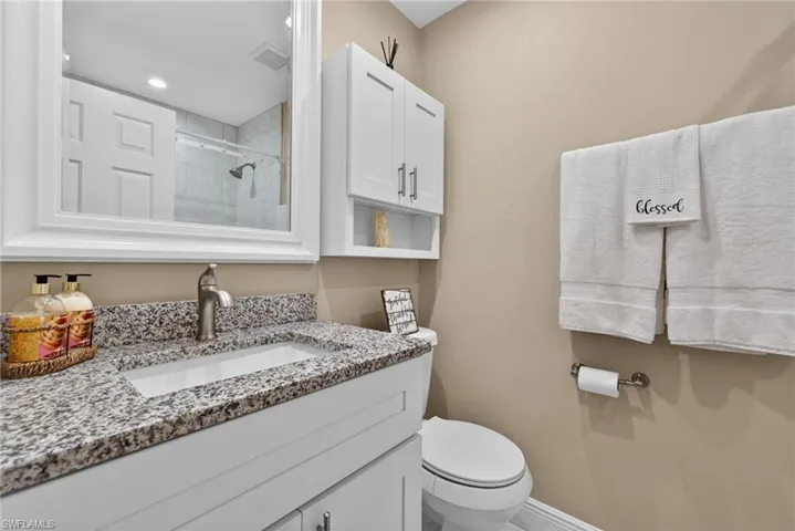 Bathroom with a tile shower and vanity