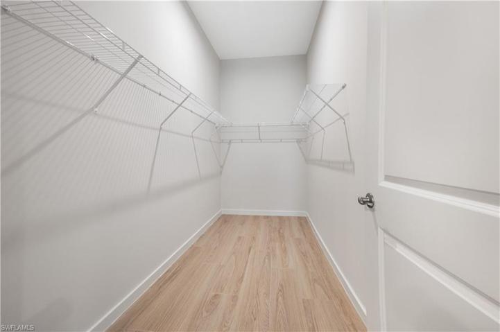 Primary Bedroom walk in closet