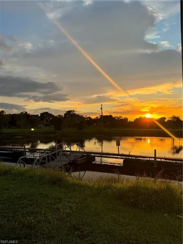 Property view of water featuring a boat dock