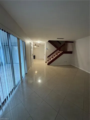 Corridor with tile patterned flooring
