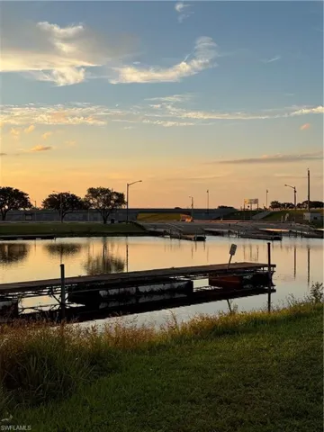 Property view of water with a dock
