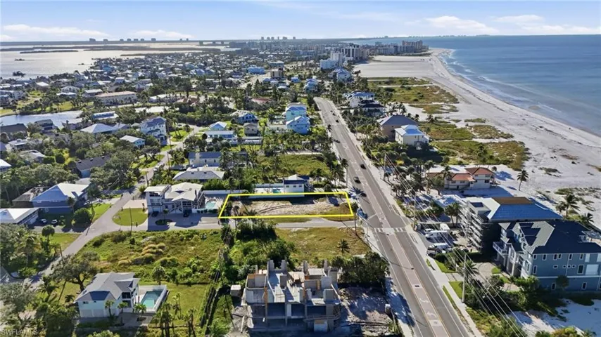 Aerial overview of property's location with property boundaries highlighted and nearby suburban area - Virtually Edited Image