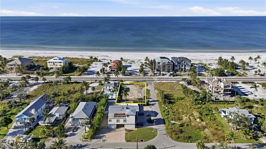 View of property location featuring waterfront with a beach - Virtually Edited Image