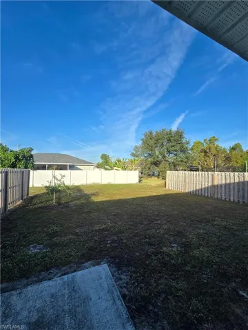 View of fenced backyard