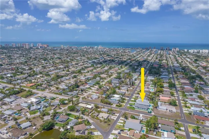 View of property location with a nearby body of water and nearby suburban area