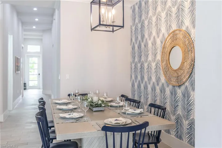Dining room with a chandelier, recessed lighting, and light wood-style floors