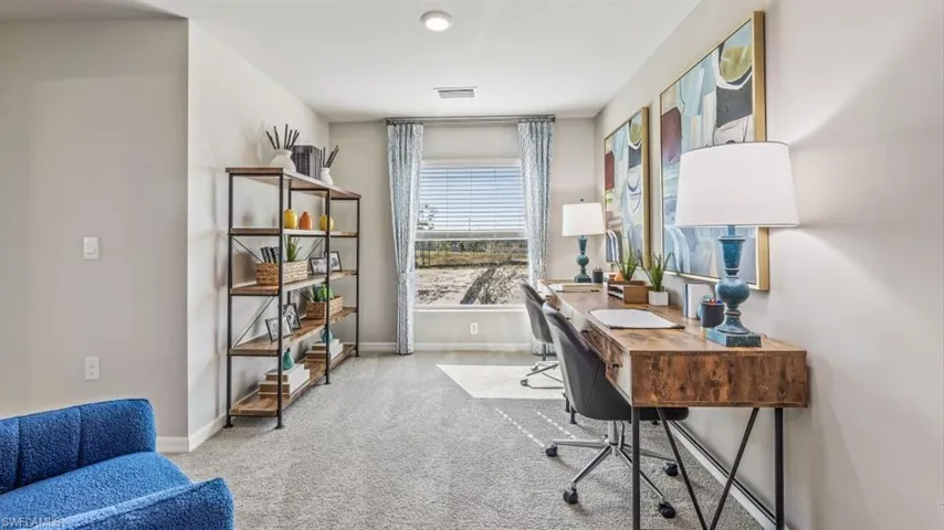 Office with light colored carpet