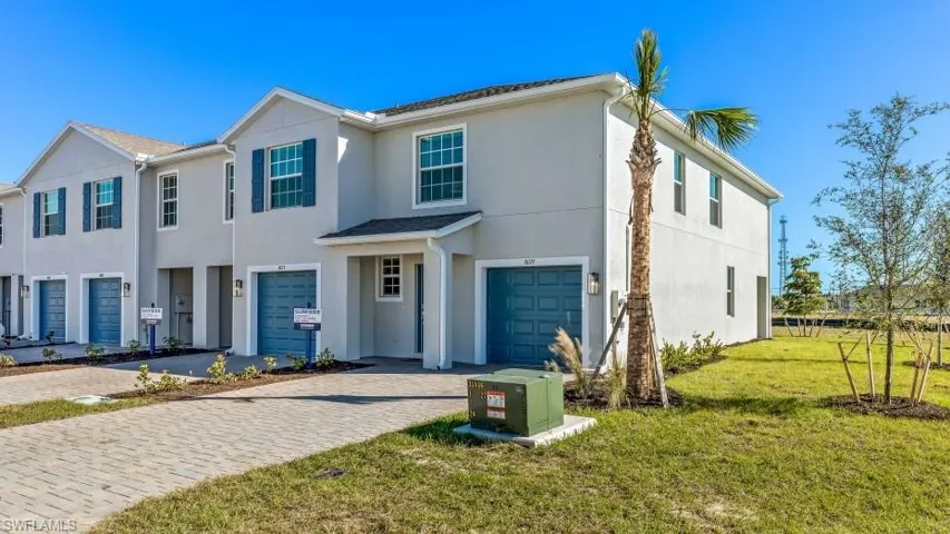 View of front facade with a garage and a front yard