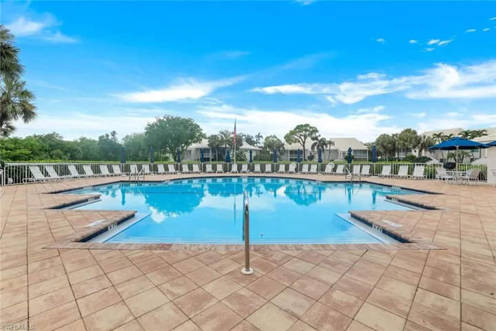 Community pool with a spa