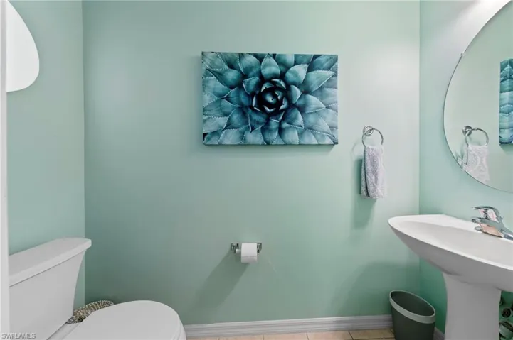 Bathroom featuring toilet and tile patterned flooring