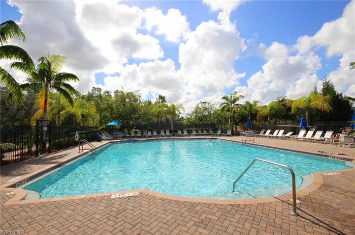 Community pool with a patio area