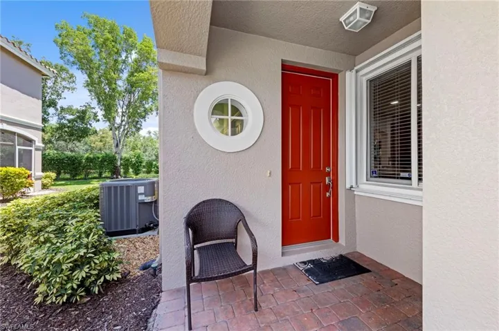 Entrance to property with stucco siding