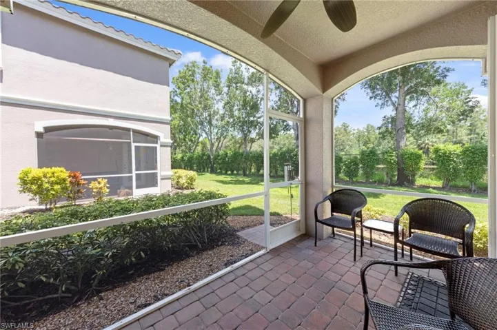 Sunroom featuring a ceiling fan