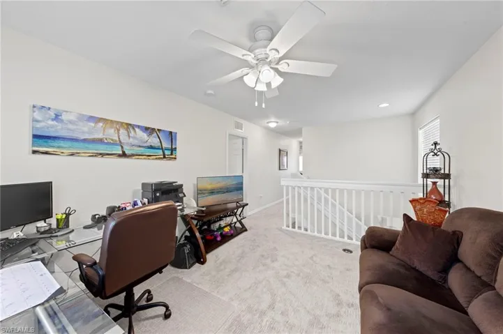 Home office featuring carpet floors, ceiling fan, and recessed lighting