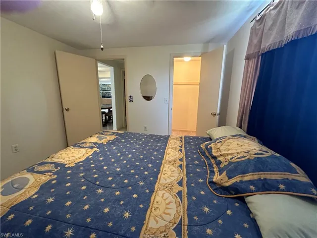 Bedroom 2 withwalk-in closet and ceiling fan