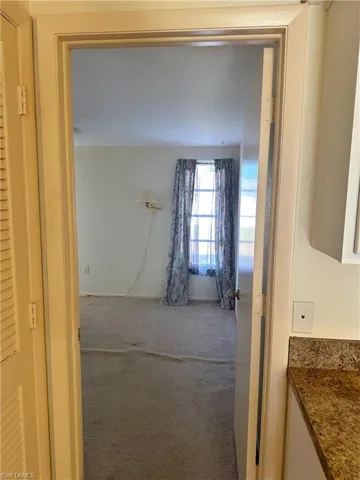 Entry to Primary bedroom off the kitchen
